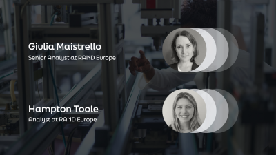 The image shows a professional slide featuring two RAND Europe analysts with their circular profile photos against a background of engineering equipment. The layout displays their titles in white text on a dark overlay.